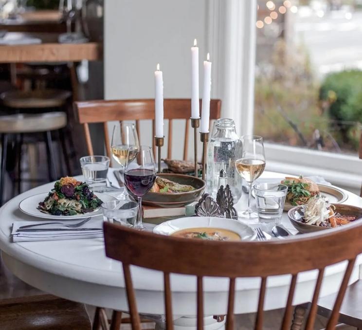 A table set for a group meal at Nourish Kitchen & Cafe in Victoria, BC