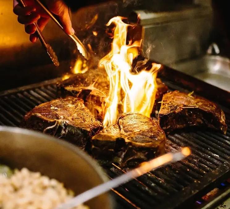 Steaks on the grill at Zambri's in Victoria, BC