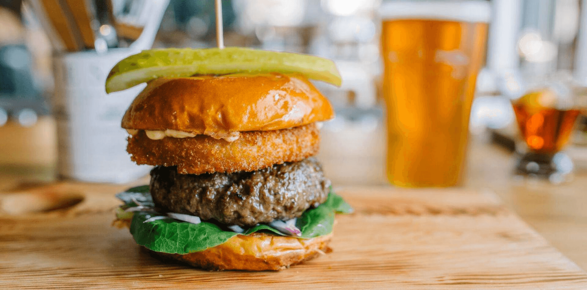 burger with pickle on top of the bun