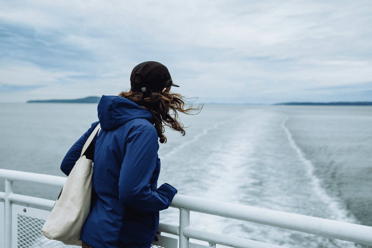 women watching the ocean from ferry