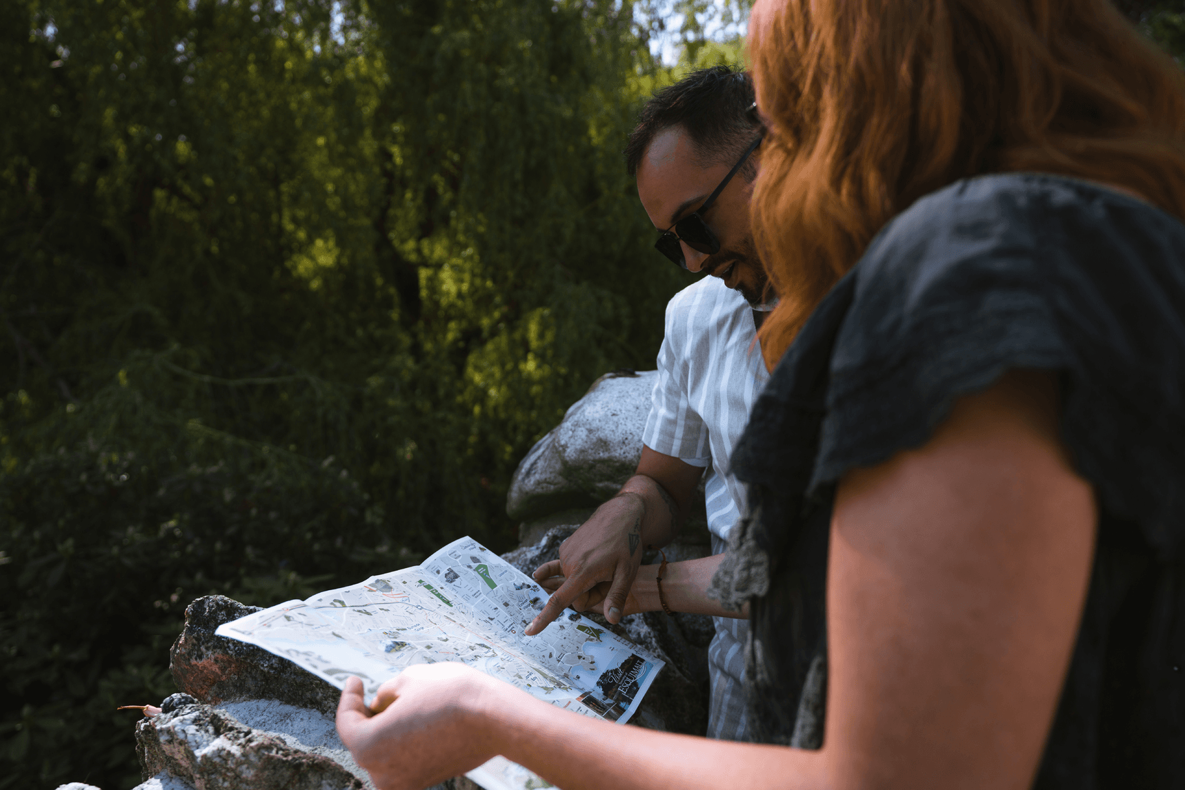 two people looking at a map of beacon hill park