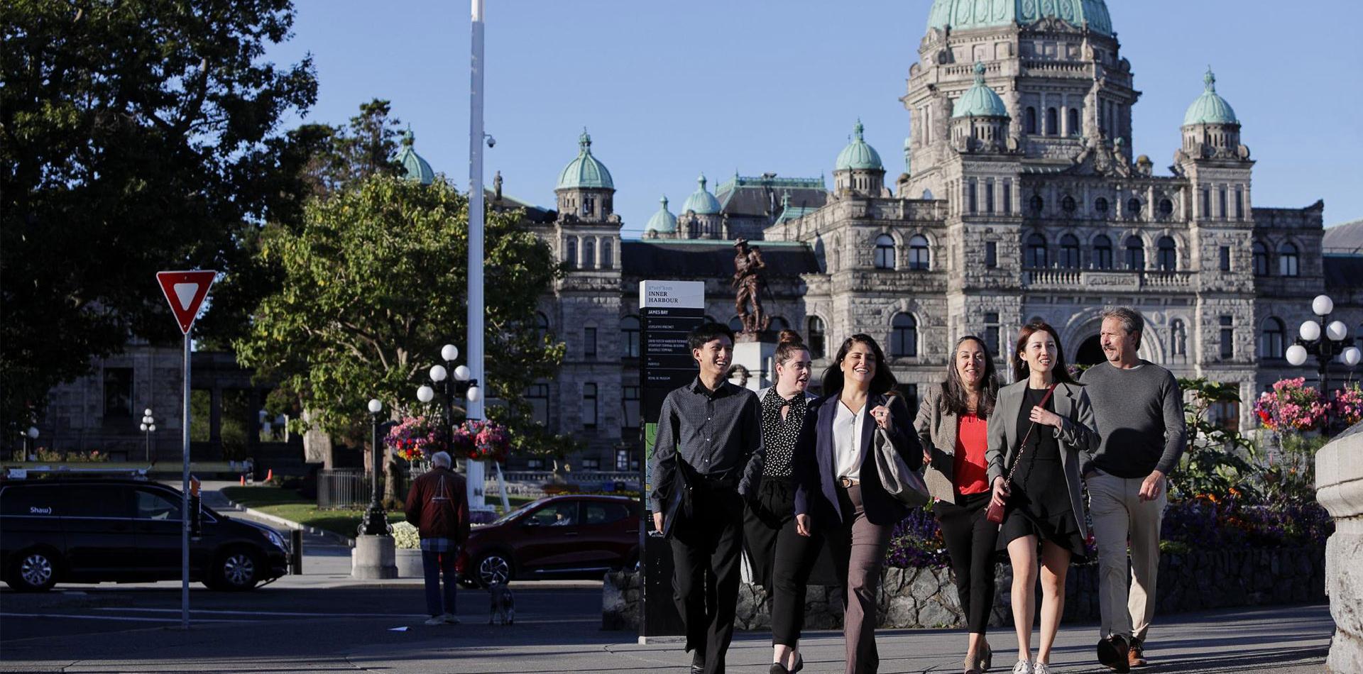 Members walking inner harbour near Parliament Building