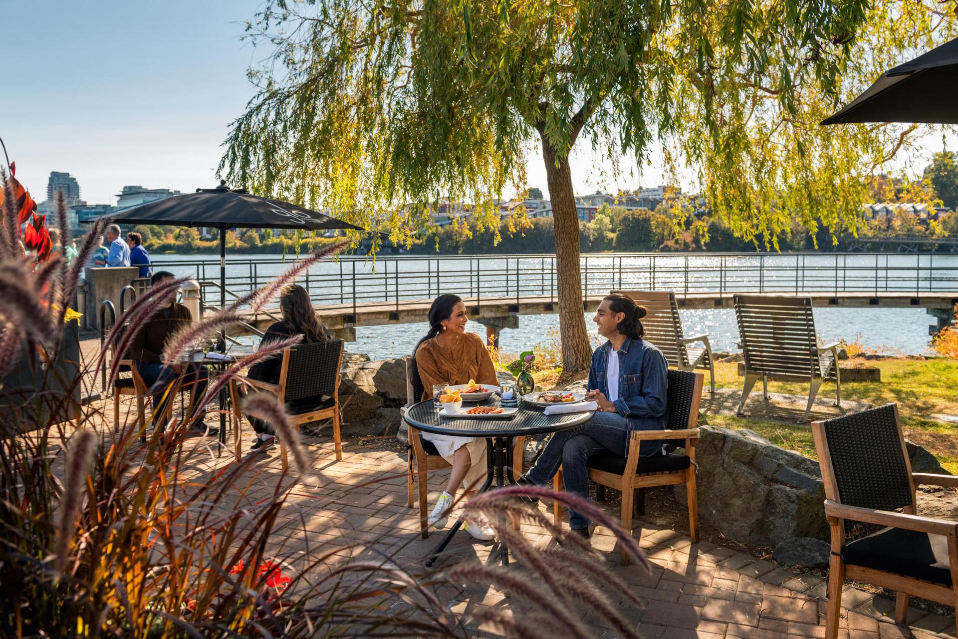 Couple dining in restaurant patio in Fall