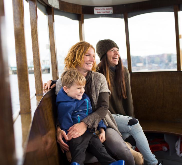 family on ferry laughing