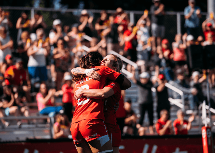 Team Canada rugby players celebrate after scoring in Victoria, BC