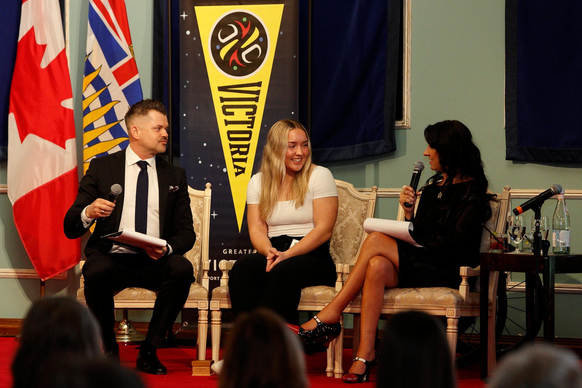 An athlete is interviewed on stage at the Greater Victoria Sports Awards