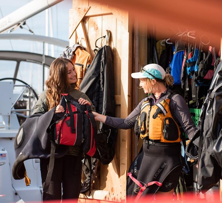 A kayaking guide prepares a guest for a paddle in Victoria, BC