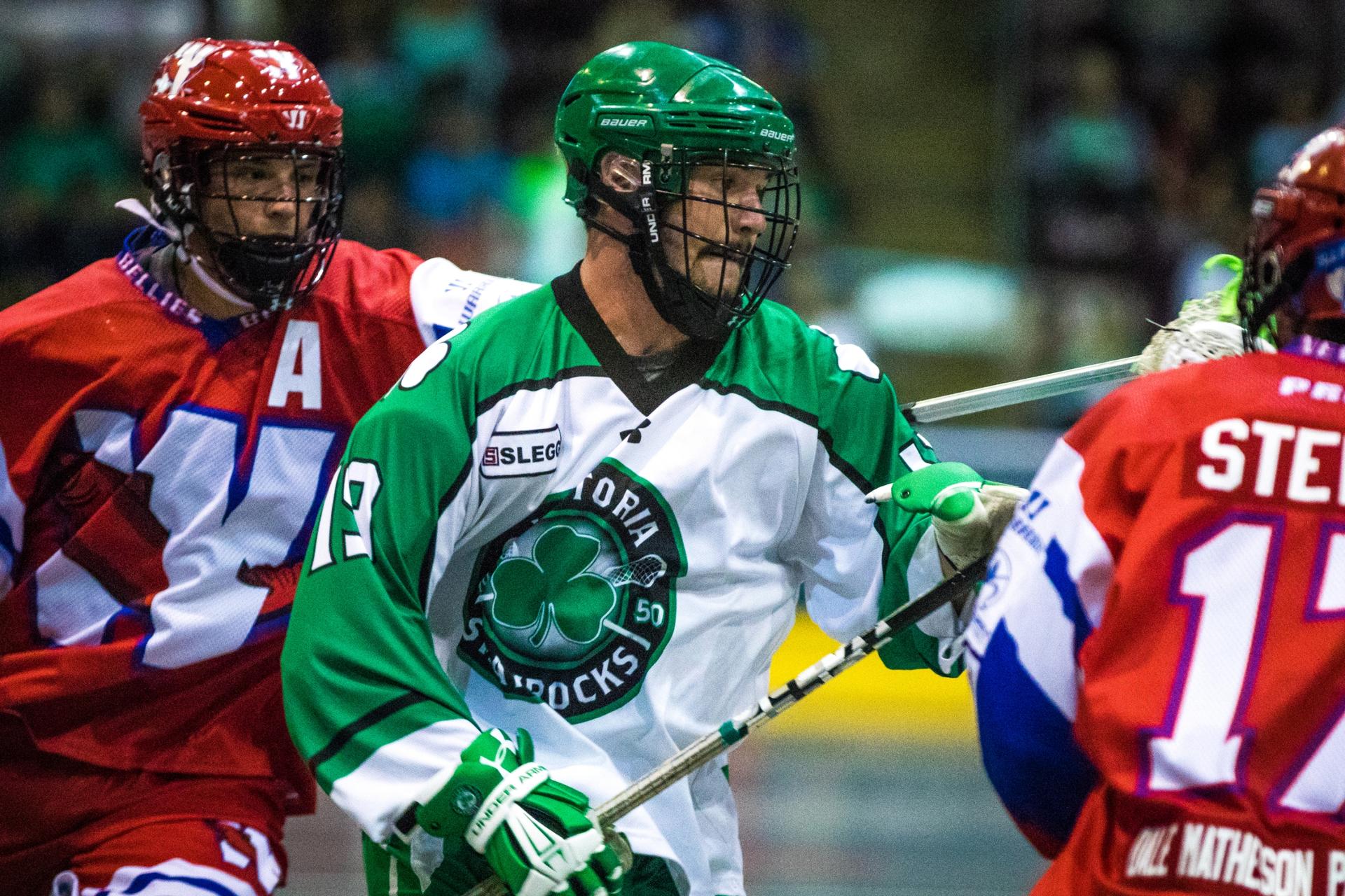 A Shamrocks players cuts through the defense in a lacrosse game in Victoria, BC