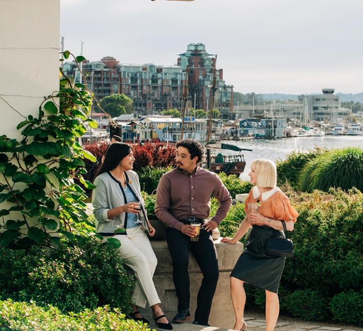 A group of young professionals networks at the Inn at Laurel Point in Victoria, BC