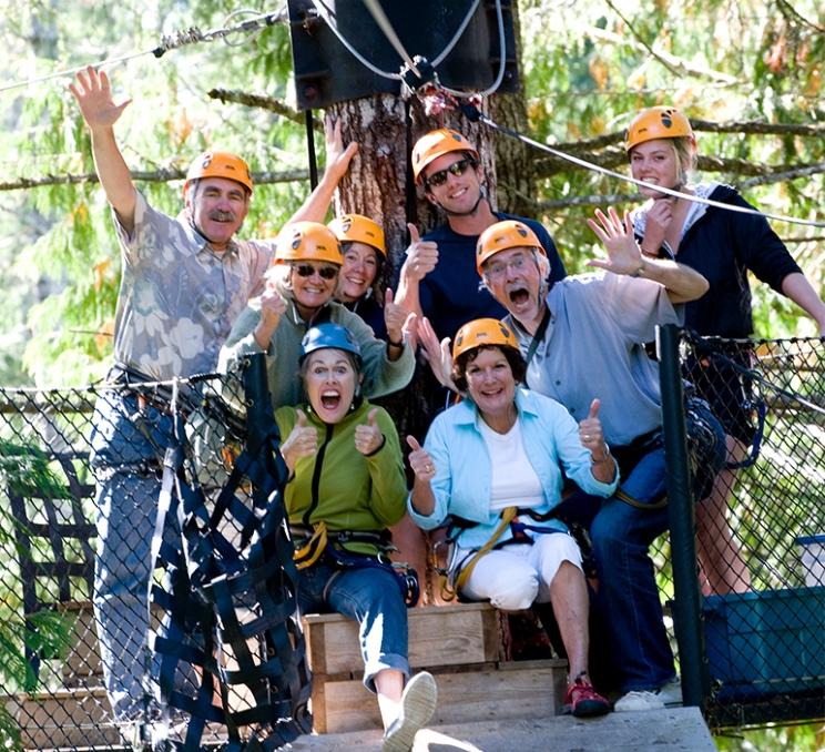 A group of delegates poses for a photo before ziplining in Victoria, BC