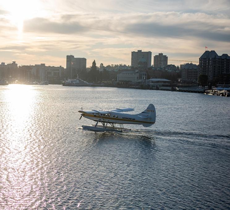 A Kenmore Air seaplane lands in the Inner Harbour of Victoria, British Columbia