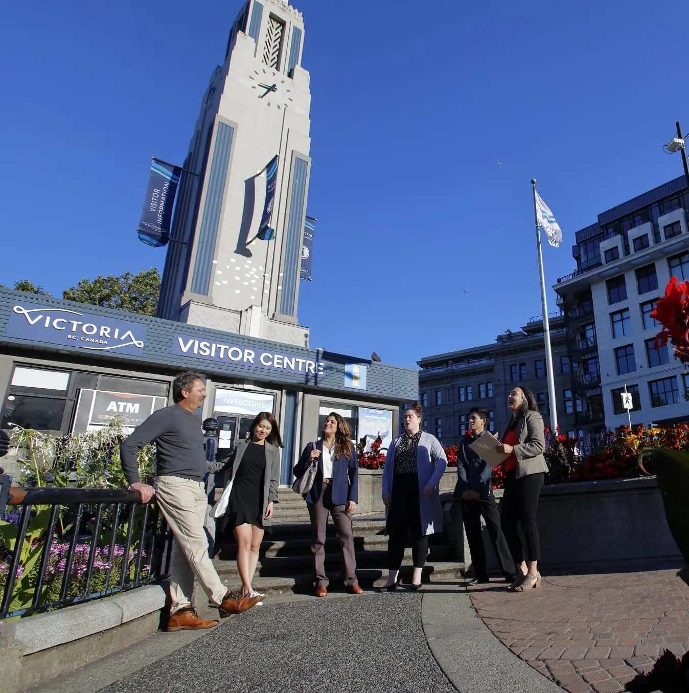 six people standing out front of the visitor centre