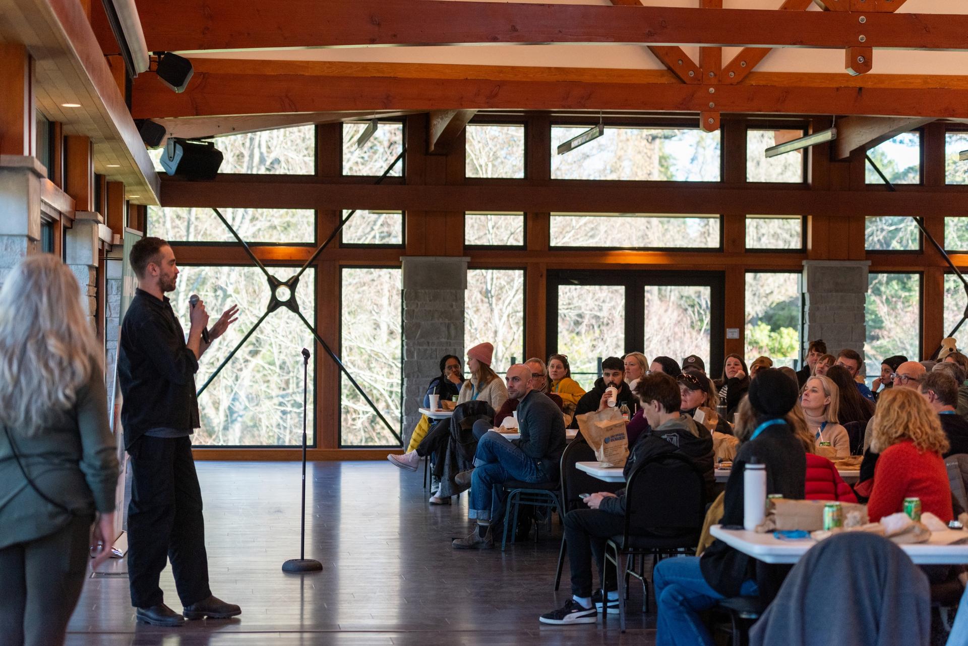 Day of IMPACT 2025 conference delegates and a speaker from Intrepid Travel.